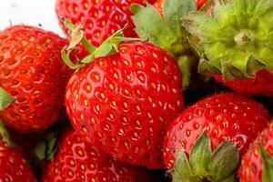 beautiful and ripe red strawberries on a white background photo