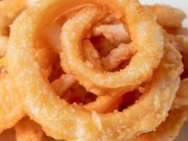 fried squid rings on white background photo