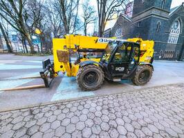 Portland, Oregon, USA -03.07.2024 Telehandler on city streets. photo