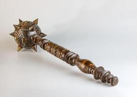 Souvenir wooden Hetman's Mace on a stand on a white background. Ukraine. photo