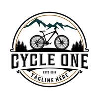 bicycle vector logo. bicycle and mountain in a circle.