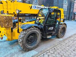 Portland, Oregon, USA -03.07.2024 Telehandler on city streets. photo