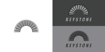 Modern typography keystone logo in grey color presented with multiple white and grey background colors. The logo is suitable for brand and fashion business logo design inspiration templates. vector