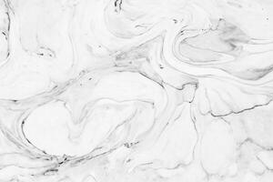 This high definition white marble texture wall features an abstract wave pattern, perfect for interior design. It can be used as a luxurious background or skin for high-end products. photo