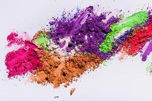 Top View of Multicolored Eyeshadow Powder on White Background photo