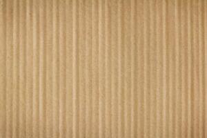 A background with a texture of brown cardboard up close. photo