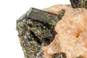 Macro of a mineral stone Vesuvianite on a white background photo