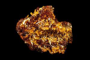 macro mineral Wulfenite stone on a black background photo