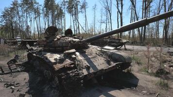 The remains of a burnt and destroyed tank of the Russian army as a result of a battle with Ukrainian troops near Kyiv. Russian aggression in Ukraine. video