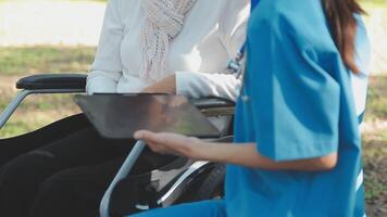 young asian physical therapist working with senior woman on walking with a walker video