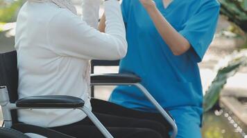 young asian physical therapist working with senior woman on walking with a walker video