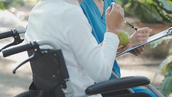 young asian physical therapist working with senior woman on walking with a walker video