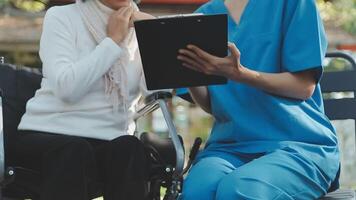 young asian physical therapist working with senior woman on walking with a walker video