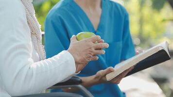 young asian physical therapist working with senior woman on walking with a walker video