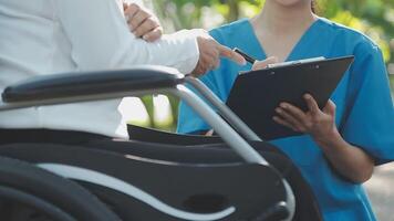 young asian physical therapist working with senior woman on walking with a walker video