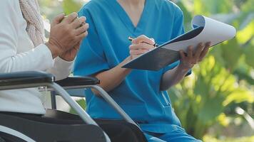 young asian physical therapist working with senior woman on walking with a walker video