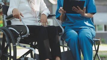 young asian physical therapist working with senior woman on walking with a walker video