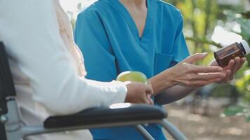 young asian physical therapist working with senior woman on walking with a walker video