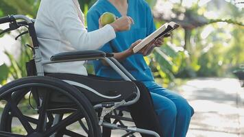 young asian physical therapist working with senior woman on walking with a walker video