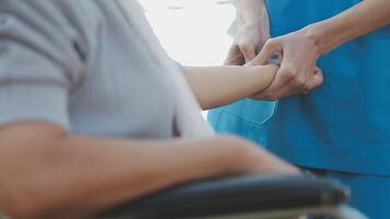 young asian physical therapist working with senior woman on walking with a walker video