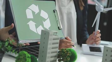 Group of business people planning and discussing on recycle reduce reuse policy symbol in office meeting room. Green business company with eco-friendly waste management regulation concept.Trailblazing video