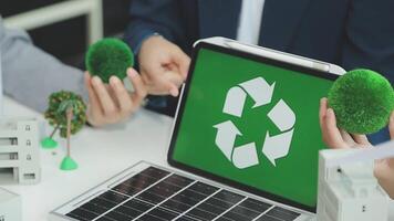 Group of business people planning and discussing on recycle reduce reuse policy symbol in office meeting room. Green business company with eco-friendly waste management regulation concept.Trailblazing video