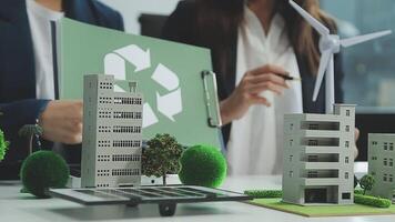 Group of business people planning and discussing on recycle reduce reuse policy symbol in office meeting room. Green business company with eco-friendly waste management regulation concept.Trailblazing video