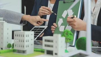 Group of business people planning and discussing on recycle reduce reuse policy symbol in office meeting room. Green business company with eco-friendly waste management regulation concept.Trailblazing video