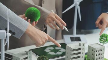 Group of business people planning and discussing on recycle reduce reuse policy symbol in office meeting room. Green business company with eco-friendly waste management regulation concept.Trailblazing video