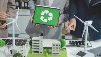 Group of business people planning and discussing on recycle reduce reuse policy symbol in office meeting room. Green business company with eco-friendly waste management regulation concept.Trailblazing video