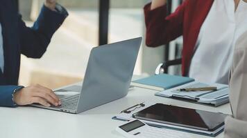 Business team collaboration discussing working analyzing with financial data and marketing growth report graph in team, presentation and brainstorming to strategy planning making profit of company. video