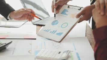 Business team collaboration discussing working analyzing with financial data and marketing growth report graph in team, presentation and brainstorming to strategy planning making profit of company. video