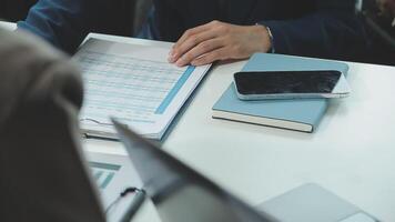 Business team collaboration discussing working analyzing with financial data and marketing growth report graph in team, presentation and brainstorming to strategy planning making profit of company. video