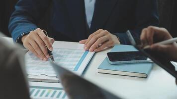 Business team collaboration discussing working analyzing with financial data and marketing growth report graph in team, presentation and brainstorming to strategy planning making profit of company. video