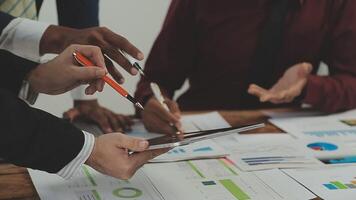 Business team collaboration discussing working analyzing with financial data and marketing growth report graph in team, presentation and brainstorming to strategy planning making profit of company. video