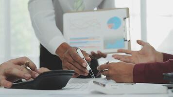 Business team collaboration discussing working analyzing with financial data and marketing growth report graph in team, presentation and brainstorming to strategy planning making profit of company. video