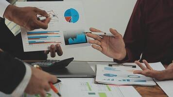 Business team collaboration discussing working analyzing with financial data and marketing growth report graph in team, presentation and brainstorming to strategy planning making profit of company. video