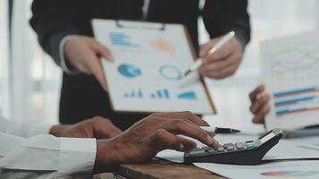 Business team collaboration discussing working analyzing with financial data and marketing growth report graph in team, presentation and brainstorming to strategy planning making profit of company. video