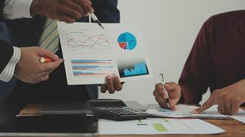 Business team collaboration discussing working analyzing with financial data and marketing growth report graph in team, presentation and brainstorming to strategy planning making profit of company. video