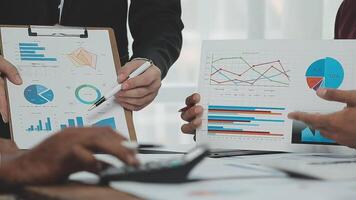 Business team collaboration discussing working analyzing with financial data and marketing growth report graph in team, presentation and brainstorming to strategy planning making profit of company. video