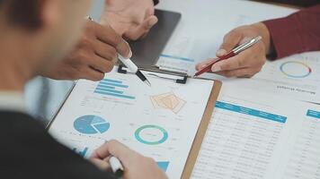 Business team collaboration discussing working analyzing with financial data and marketing growth report graph in team, presentation and brainstorming to strategy planning making profit of company. video