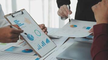 Business team collaboration discussing working analyzing with financial data and marketing growth report graph in team, presentation and brainstorming to strategy planning making profit of company. video