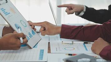 Business team collaboration discussing working analyzing with financial data and marketing growth report graph in team, presentation and brainstorming to strategy planning making profit of company. video
