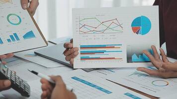 Business team collaboration discussing working analyzing with financial data and marketing growth report graph in team, presentation and brainstorming to strategy planning making profit of company. video