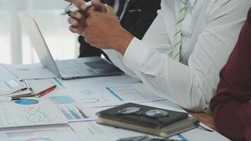 Business team collaboration discussing working analyzing with financial data and marketing growth report graph in team, presentation and brainstorming to strategy planning making profit of company. video