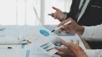 Business team collaboration discussing working analyzing with financial data and marketing growth report graph in team, presentation and brainstorming to strategy planning making profit of company. video