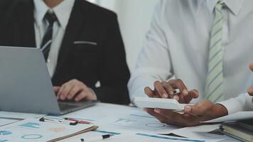 Business team collaboration discussing working analyzing with financial data and marketing growth report graph in team, presentation and brainstorming to strategy planning making profit of company. video