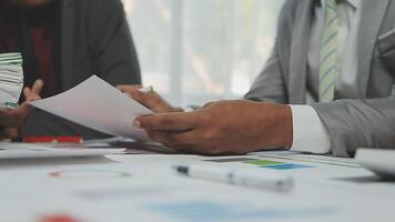 Business team collaboration discussing working analyzing with financial data and marketing growth report graph in team, presentation and brainstorming to strategy planning making profit of company. video