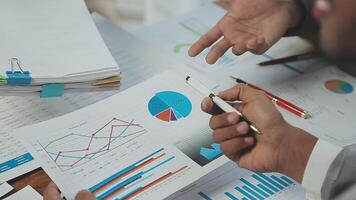 Business team collaboration discussing working analyzing with financial data and marketing growth report graph in team, presentation and brainstorming to strategy planning making profit of company. video