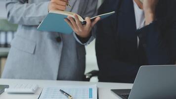Business team collaboration discussing working analyzing with financial data and marketing growth report graph in team, presentation and brainstorming to strategy planning making profit of company. video
